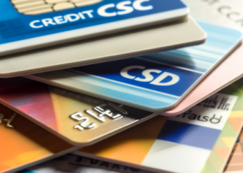 A close shot of a stack of credit cards from different financial institutions