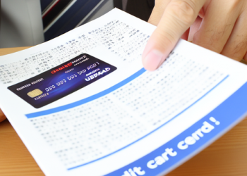 A person reading a credit card brochure