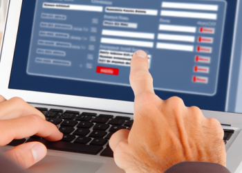 A person scrutinizing a credit report on a computer screen