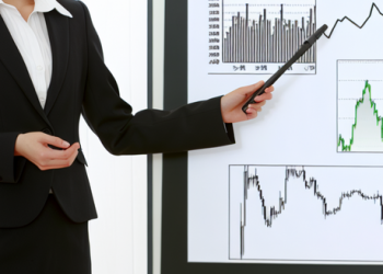 An image of a well-dressed woman giving a presentation about investment strategy