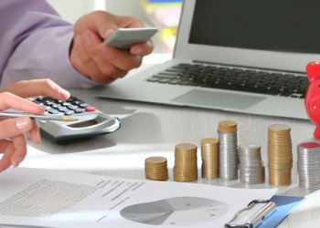 Personal finances being discussed with a home office background